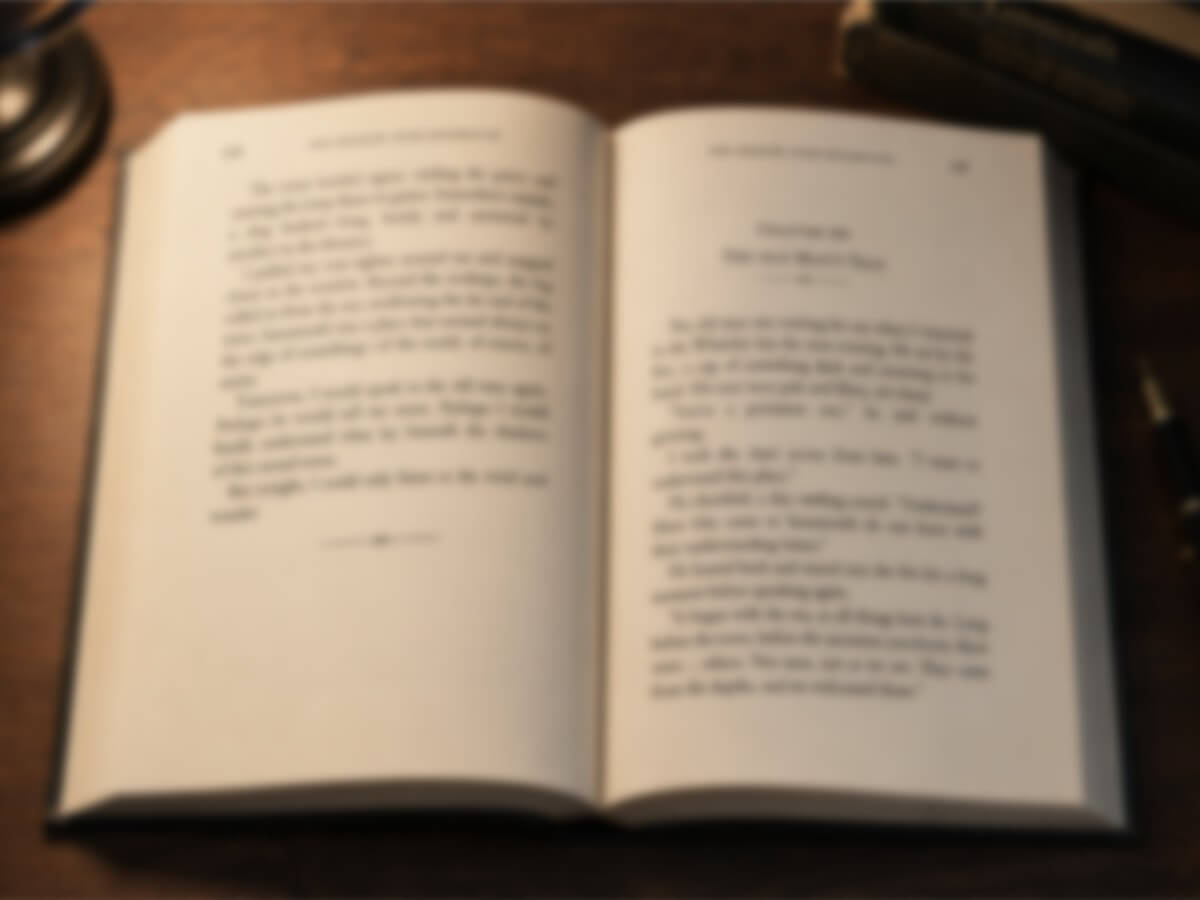 A blurry low quality image of a book with text on the pages