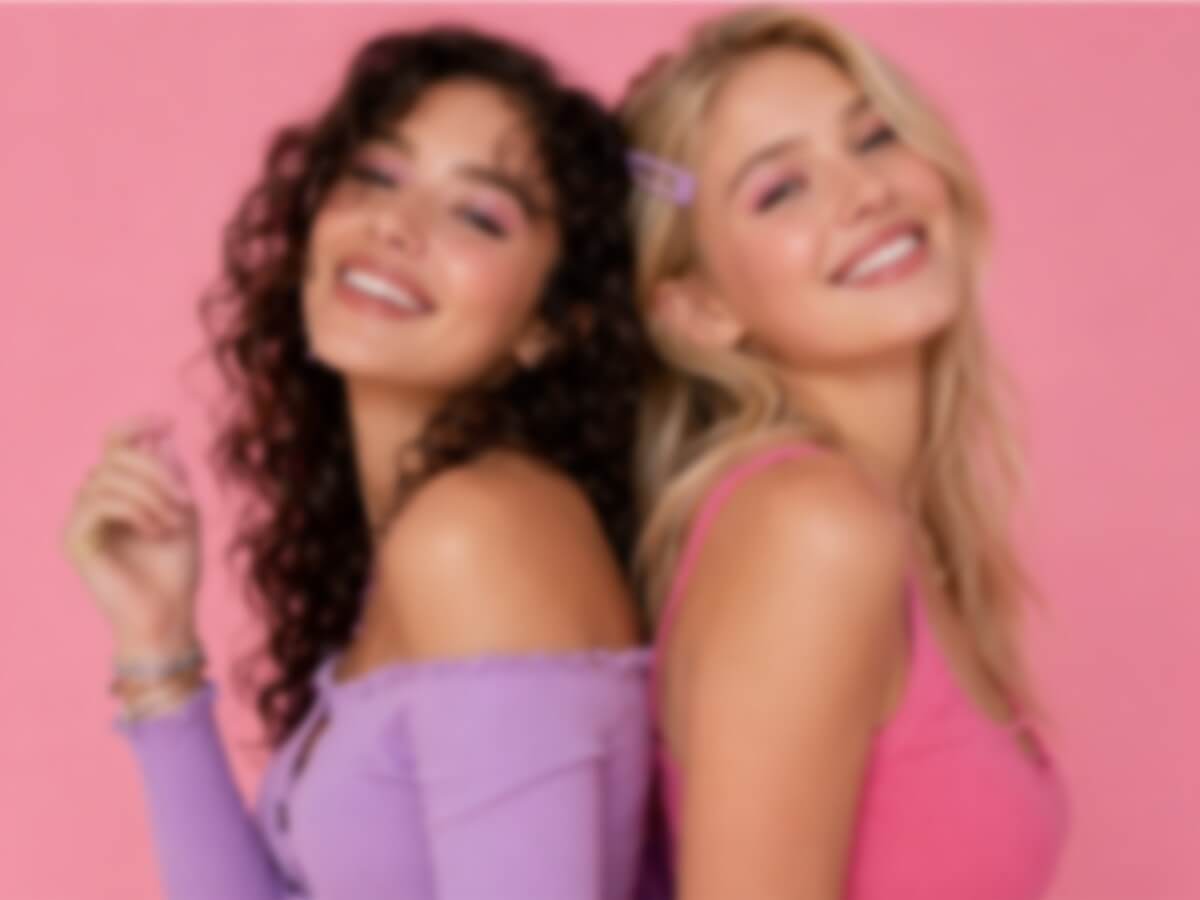 A blurry photo of two female friends posing together