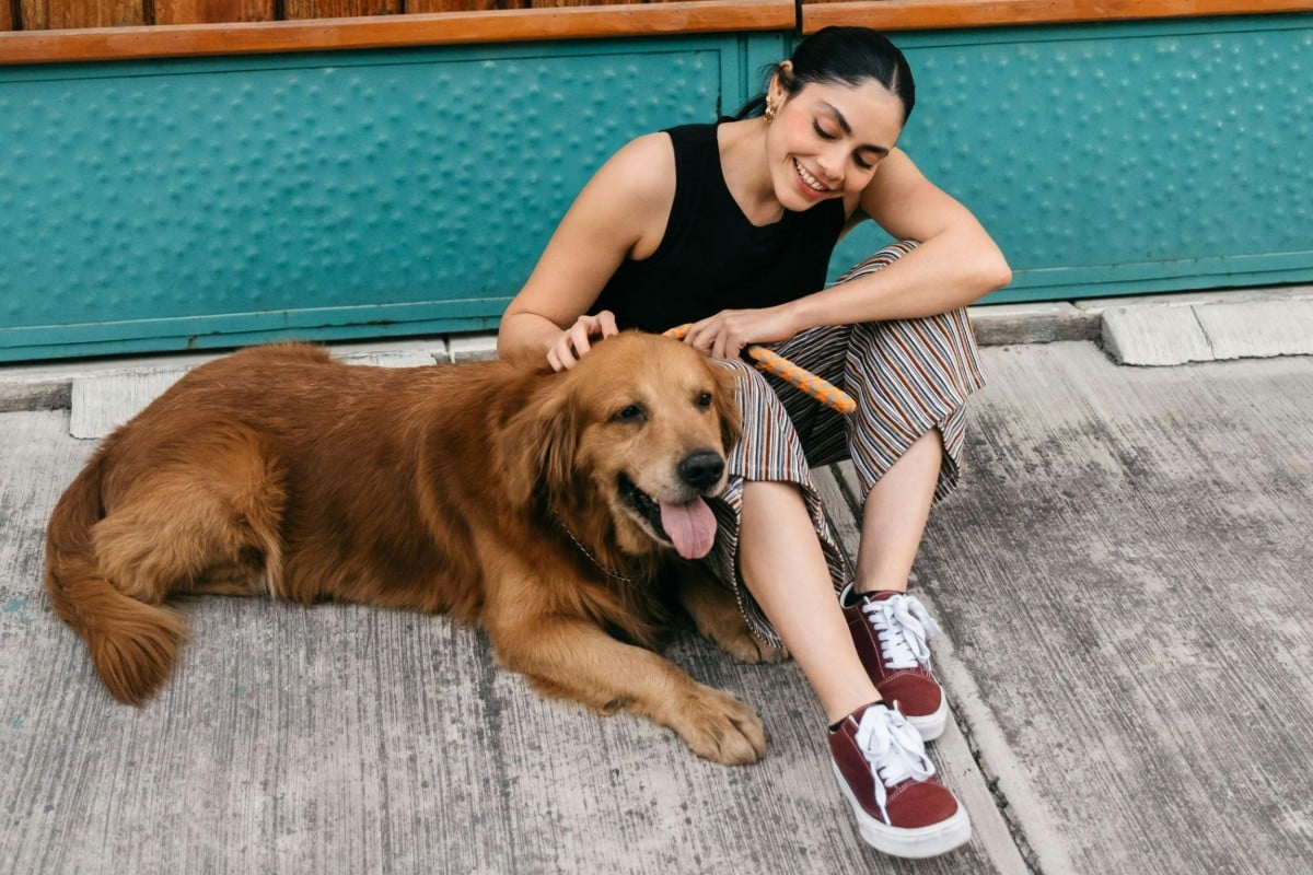 Original picture showing a female and a lovely dog
